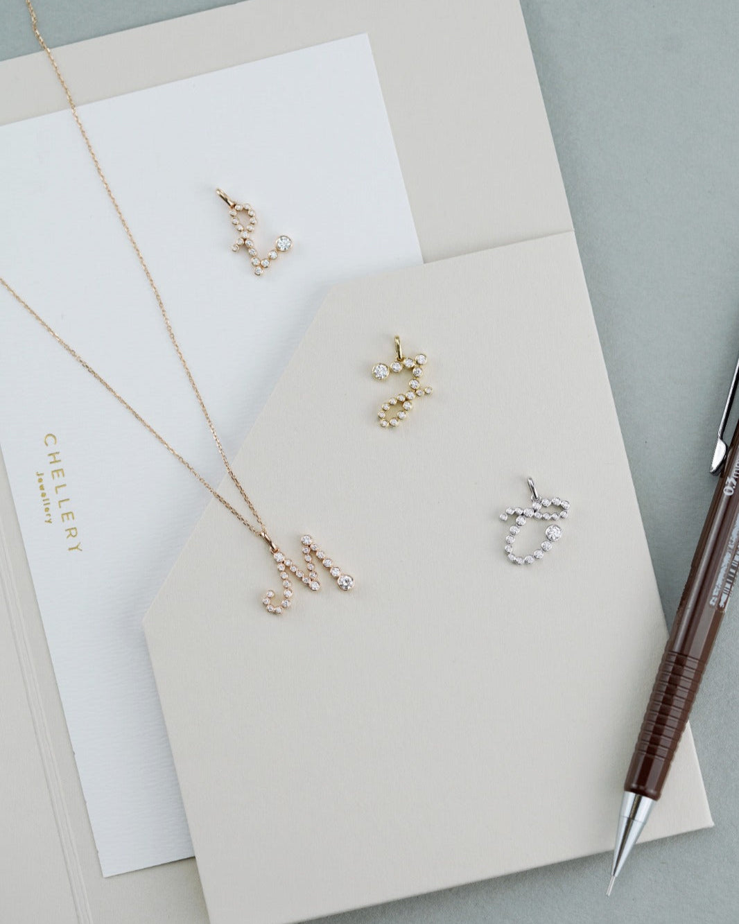 The Chellery Little Lightbulb Initial Diamond Necklace